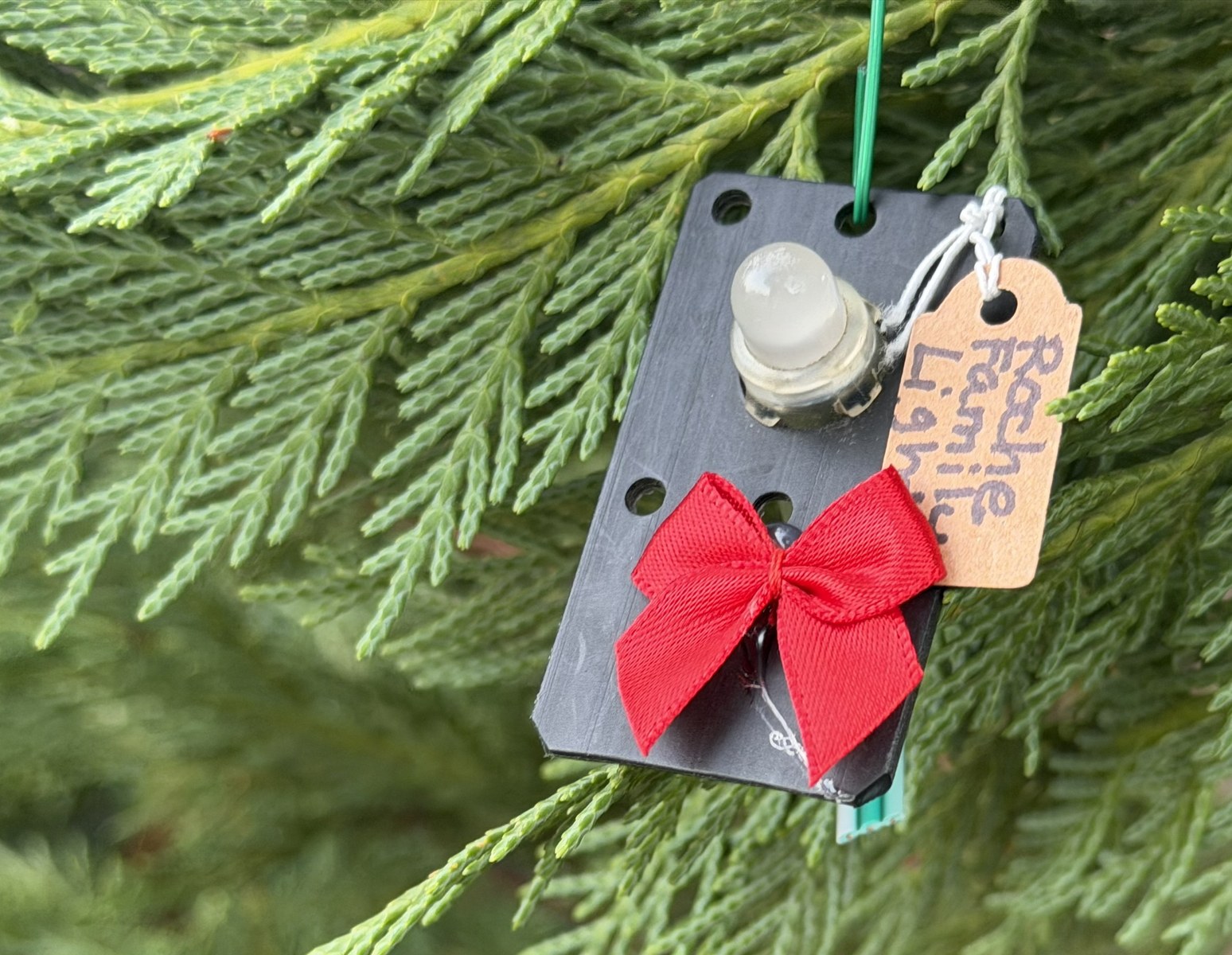 Handmade ornament crafted from retired show lights